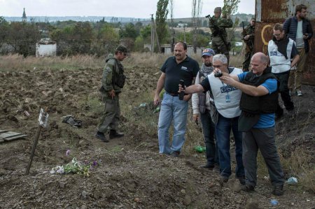 Захоронения под Донецком: у тел отсутствуют внутренние органы